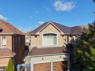 Colonial Brown Interlock Cedar Shingle aluminum roof on a Colonial-style home with a brown metal roof and attached, Mississauga, Ontario