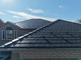 Tudor Brown Interlock Slate aluminum roof on a Tudor brown metal roof on a single-family home in rural, Lindsay, Ontario