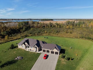 Tudor Brown Interlock Slate aluminum roof on a brown ranch home with a metal roof on a lake in a rural, Kawartha Lakes, Ontario