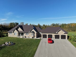 Tudor Brown Interlock Slate aluminum roof on a Tudor home with a brown metal roof in a rural setting, Kawartha Lakes, Ontario
