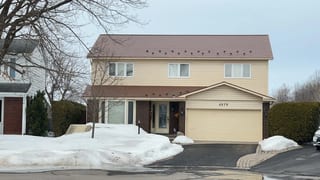 Aged Copper Interlock Shingle aluminum roof on a two-storey home with dormers in a suburban neighbourhood, Orléans, Ontario
