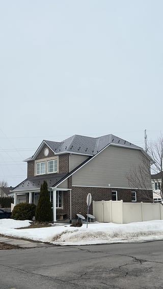 Tudor Brown Interlock Slate aluminum roof on a two-storey Tudor home with dormers in a suburban, Orléans, Ontario