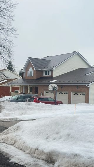 Colonial Brown Interlock Cedar Shingle aluminum roof on a two-storey Colonial home with dormers in a suburban, Ottawa, Ontario