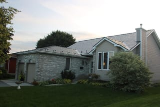 Deep Charcoal Interlock Cedar Shingle aluminum roof on a single-storey home with a grey Interlock metal roof and, Kingston, Ontario