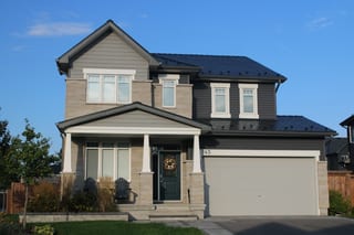 Black Interlock Slate aluminum roof on a two-storey modern home with black metal roof in suburban, Carleton Place, Ontario