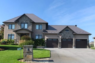 Tudor Brown Interlock Cedar Shingle aluminum roof on a Tudor brown metal roof on a colonial home in a suburban, Greely, Ontario