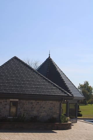 Deep Charcoal Interlock Slate aluminum roof on a modern home with a deep charcoal metal roof in a suburban, Alexandria, Ontario