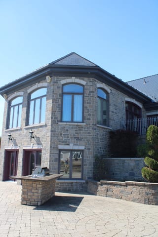 Deep Charcoal Interlock Slate aluminum roof on a deep charcoal modern home with a metal roof in a rural, Alexandria, Ontario