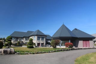 Deep Charcoal Interlock Slate aluminum roof on a Deep Charcoal metal roof on a colonial home in a suburban, Alexandria, Ontario