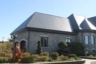 Deep Charcoal Interlock Slate aluminum roof on a two-storey home with dormers in a suburban neighbourhood, Alexandria, Ontario