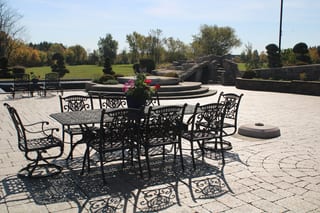 Deep Charcoal Interlock Slate aluminum roof on a two-storey home with a metal roof among tall pines, Alexandria, Ontario
