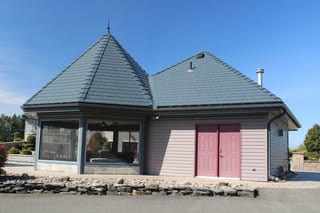 Deep Charcoal Interlock Slate aluminum roof on a two-storey home with dormers and metal roof in Deep, Alexandria, Ontario