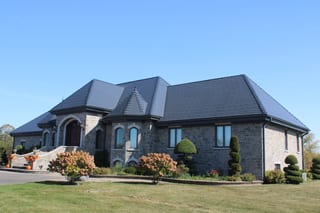 Deep Charcoal Interlock Slate aluminum roof on a modern single-family home in a rural suburban area, Alexandria, Ontario