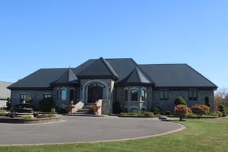 Deep Charcoal Interlock Slate aluminum roof on a modern single-family home with a metal roof in a suburban, Alexandria, Ontario