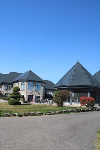 Deep Charcoal Interlock Slate aluminum roof on a two-storey home with a Deep Charcoal metal roof in a, Alexandria, Ontario