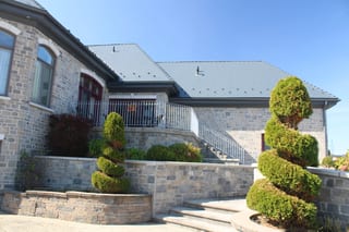 Deep Charcoal Interlock Slate aluminum roof on a Deep Charcoal metal roof on a two-storey home in a, Alexandria, Ontario