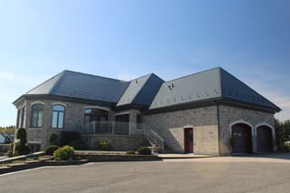 Deep Charcoal Interlock Slate aluminum roof on a deep charcoal metal roof on a modern home in a rural, Alexandria, Ontario
