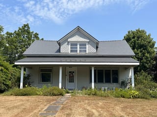 Musket Grey Interlock Slate aluminum roof on a cottage with a Musket Grey Interlock Slate metal roof, Bloomfield, Ontario