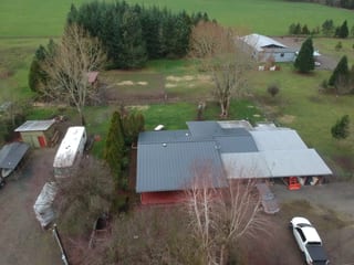Deep Charcoal Interlock Standing Seam aluminum roof on a deep charcoal metal roof on a ranch style home in a rural, Scio, Oregon