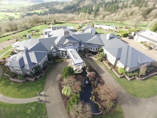 Deep Charcoal Interlock IB Membrane aluminum roof on a Deep Charcoal metal roof on a two-storey home in a, Turner, Oregon