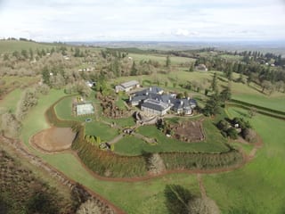 Deep Charcoal Interlock IB Membrane aluminum roof on a single-family home with a metal roof in a rural setting, Turner, Oregon
