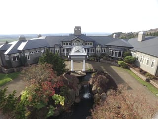 Deep Charcoal Interlock IB Membrane aluminum roof on a single-family home with a metal roof in a rural setting, Turner, Oregon