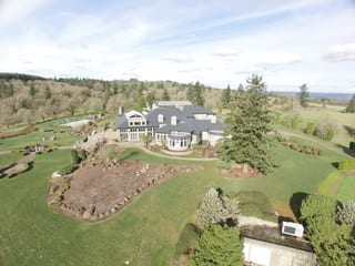 Deep Charcoal Interlock IB Membrane aluminum roof on a Deep Charcoal Interlock metal roof on a two-storey home, Turner, Oregon