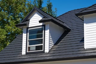 Deep Charcoal Interlock Shake aluminum roof on a Deep Charcoal metal roof on a modern home among forested, Portland, Oregon