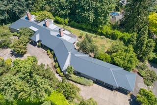 Deep Charcoal Interlock Slate aluminum roof on a single-storey Deep Charcoal metal roof on a ranch home in, Portland, Oregon