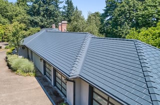 Deep Charcoal Interlock Slate aluminum roof on a single-family home with a metal roof in an urban/suburban, Portland, Oregon