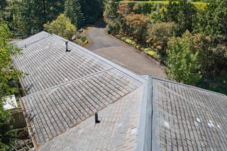 Before: a leaking natural slate roof on the home, Portland, Oregon, ahead of a Deep Charcoal Interlock Slate aluminum roof