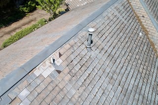 Before: a leaking natural slate roof on the home, Portland, Oregon, ahead of a Deep Charcoal Interlock Slate aluminum roof