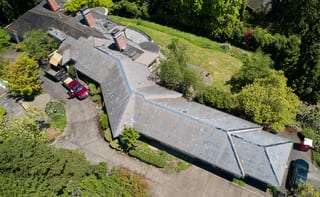 Before: a leaking natural slate roof on the home, Portland, Oregon, ahead of a Deep Charcoal Interlock Slate aluminum roof