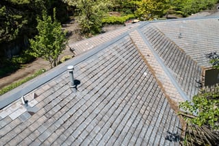Before: a leaking natural slate roof on the home, Portland, Oregon, ahead of a Deep Charcoal Interlock Slate aluminum roof