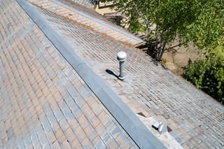 Before: a leaking natural slate roof on the home, Portland, Oregon, ahead of a Deep Charcoal Interlock Slate aluminum roof