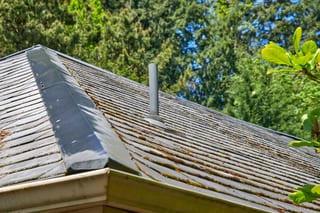 Before: a natural slate roof on the home, Portland, Oregon, ahead of a Deep Charcoal Interlock Slate aluminum roof