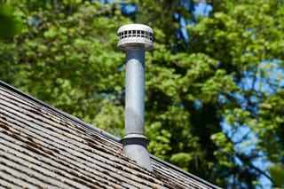 Before: the old roof on a Deep Charcoal Interlock Slate roof on a single-family, Portland, Oregon, ahead of a Deep Charcoal Interlock Slate aluminum roof