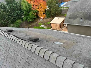 Before: a leaking asphalt shingle roof on the home, Newberg, Oregon, ahead of a Deep Charcoal Interlock Cedar Shingle aluminum roof