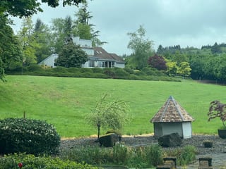 Before: a concrete tile roof with broken tiles on the home, Amity, Oregon, ahead of a Deep Charcoal Interlock Slate aluminum roof