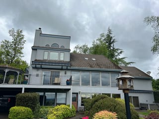 Before: a concrete tile roof with broken tiles on the home, Amity, Oregon, ahead of a Deep Charcoal Interlock Slate aluminum roof