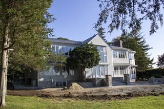 Deep Charcoal Interlock Slate aluminum roof on a colonial style home with a metal roof on a rural property, Warwick, Rhode Island