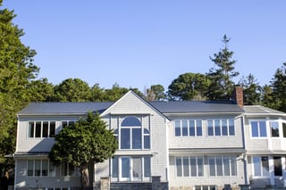 Deep Charcoal Interlock Slate aluminum roof on a colonial home with a metal roof in a wooded area, Warwick, Rhode Island