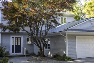 Deep Charcoal Interlock Slate aluminum roof on a grey colonial home with dormers and a slate metal roof, Warwick, Rhode Island