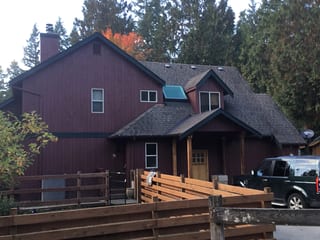 Before: a rotten asphalt shingle roof on the home, Woodinville, Washington, ahead of a Charcoal Grey Interlock Shingle aluminum roof
