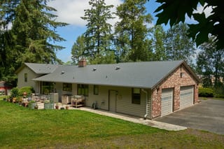 Musket Grey Interlock Cedar Shingle aluminum roof on a Musket Grey metal roof on a two-storey ranch style home, Arlington, Washington