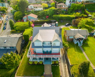 Musket Grey Interlock Slate aluminum roof on a two-storey craftsman home with a grey metal roof in a, Seattle, Washington