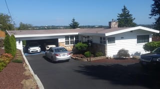 Before: the old roof on the home, Des Moines, Washington, ahead of a Black Interlock Standing Seam aluminum roof