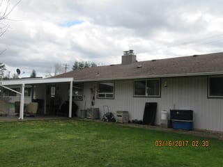 Before: a worn out asphalt shingle roof on the home, Marysville, Washington, ahead of a Deep Charcoal Interlock Slate aluminum roof