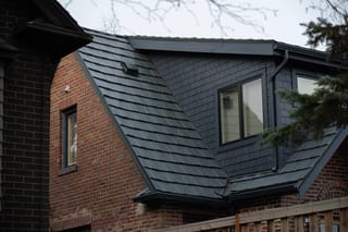 Deep Charcoal Interlock Shake aluminum roof on a modern single-family home with a deep charcoal metal roof, Seattle, Washington