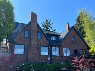 Deep Charcoal Interlock Shake aluminum roof on a deep charcoal Interlock Shake metal roof on a Tudor home, Seattle, Washington